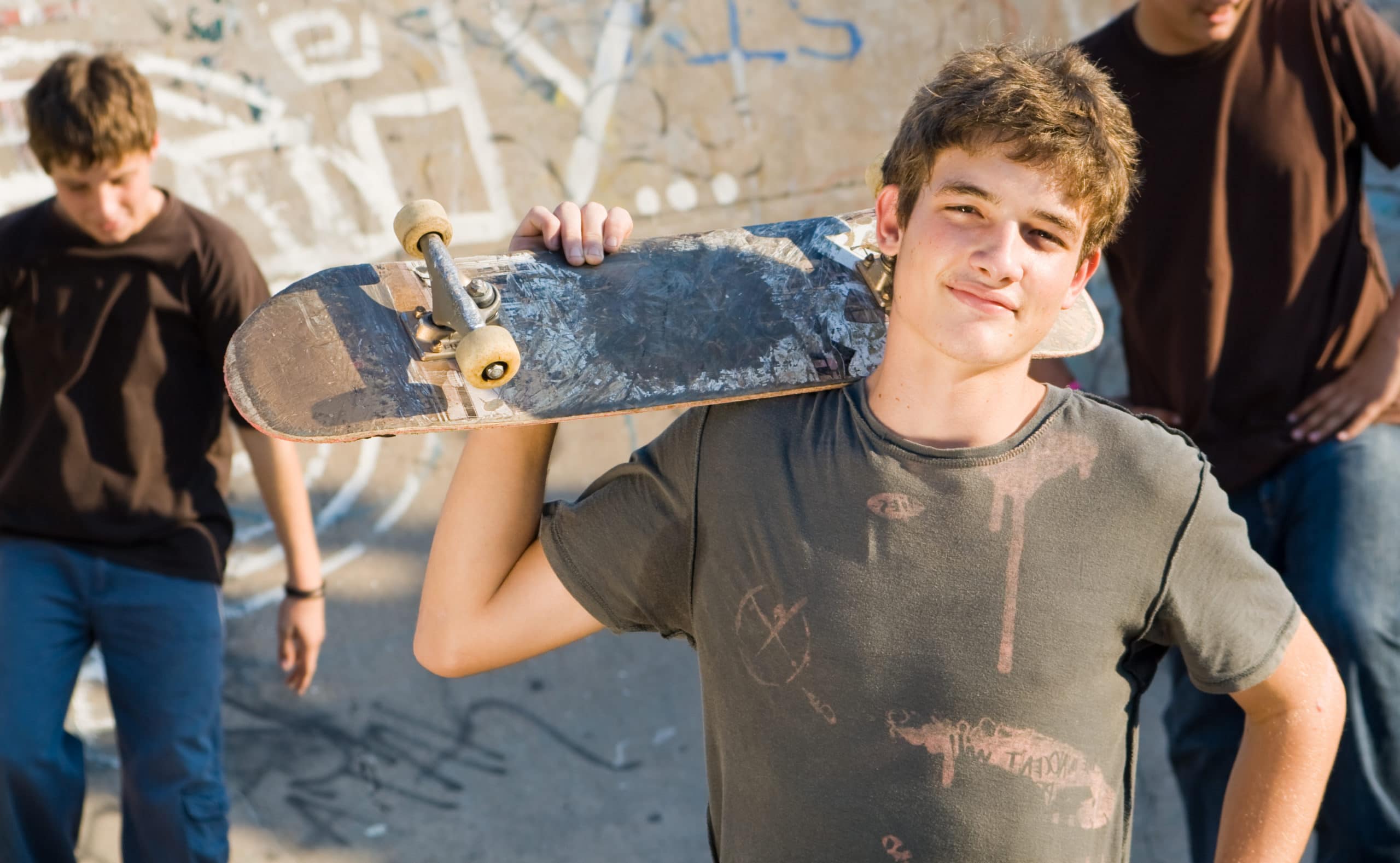 boy holding skateboard