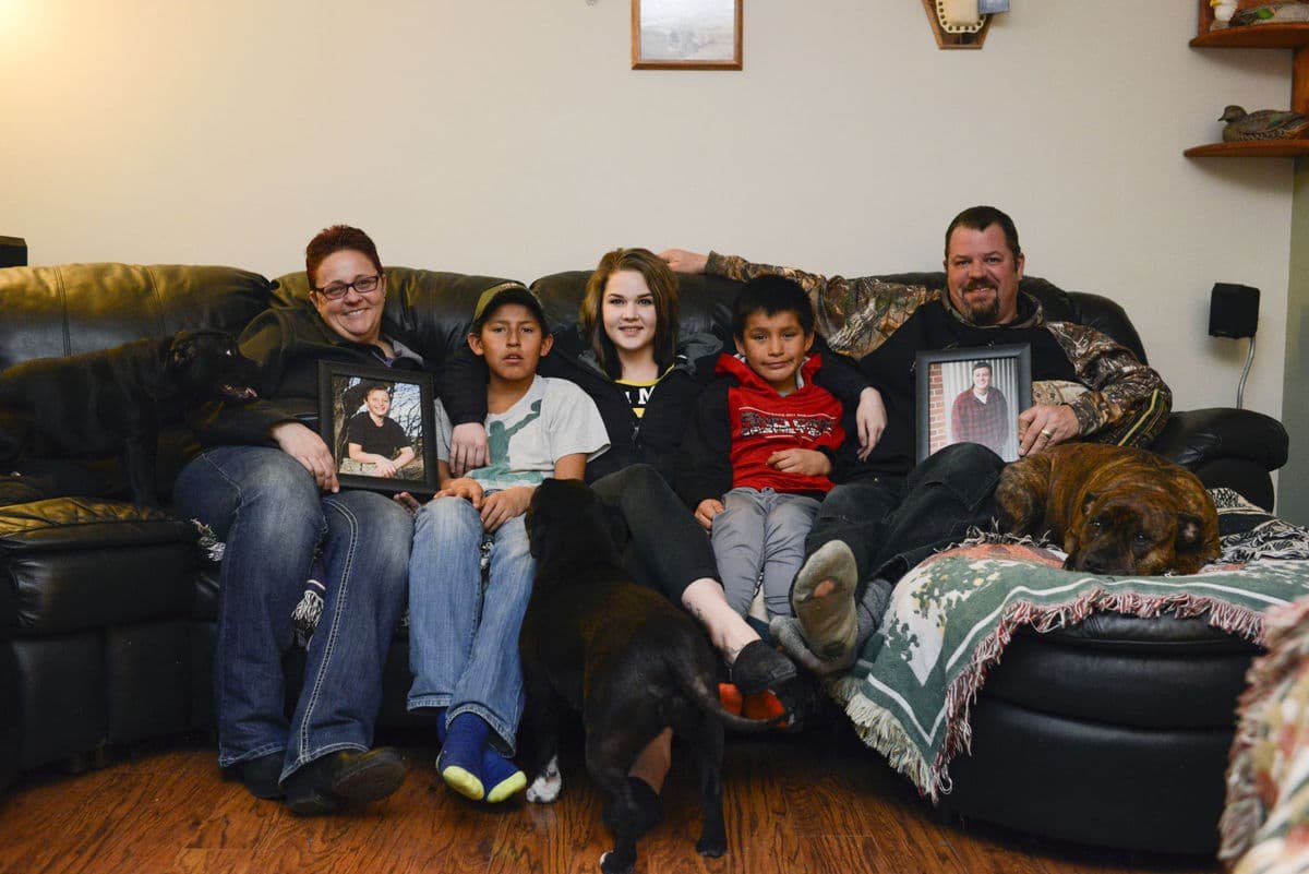 family sitting on couch