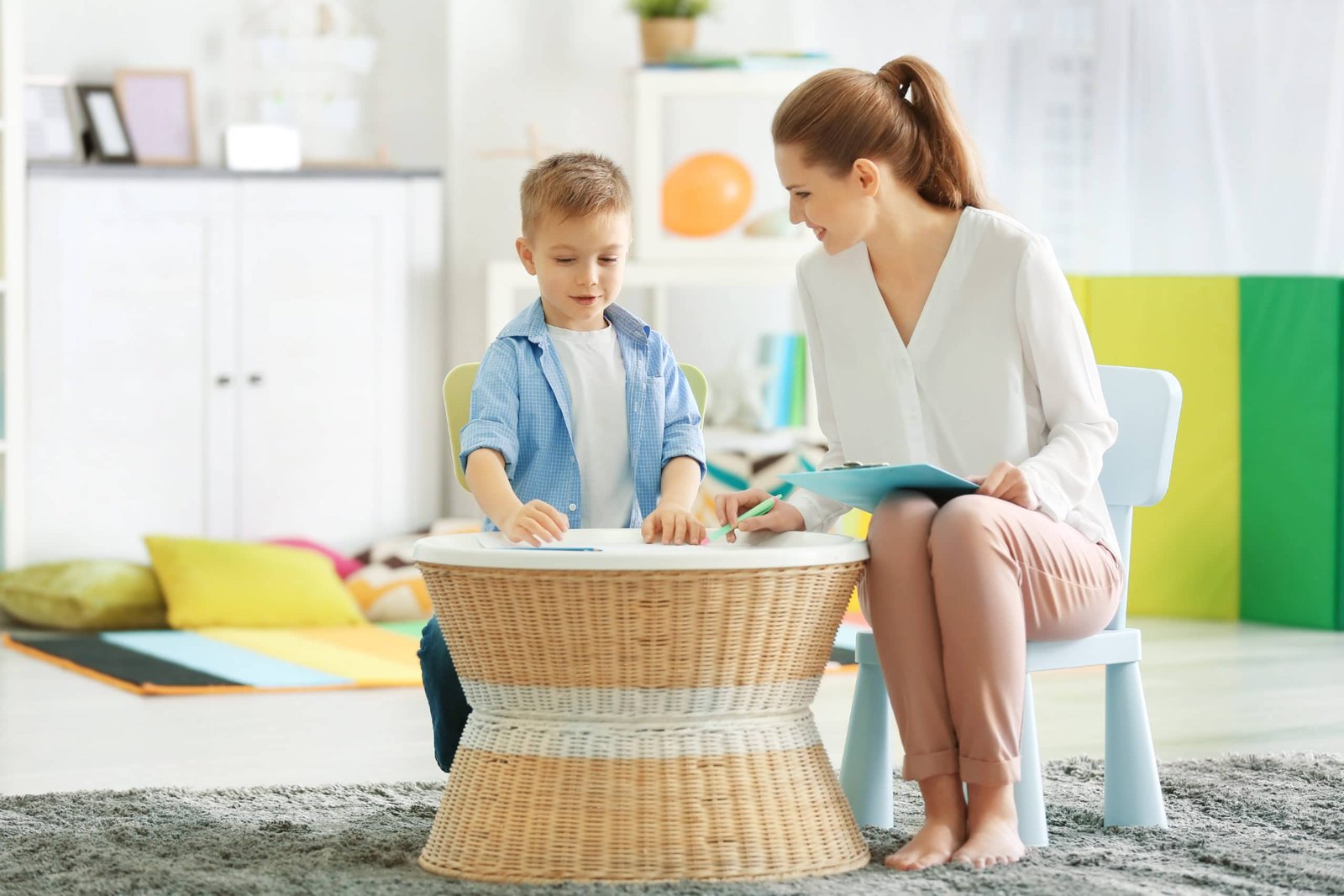 psychologist working with little boy