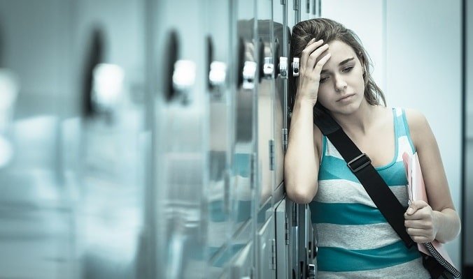 teenager by lockers