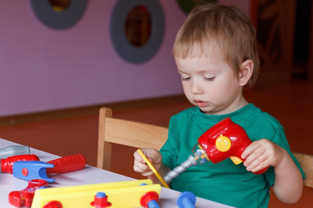 kid playing with toys