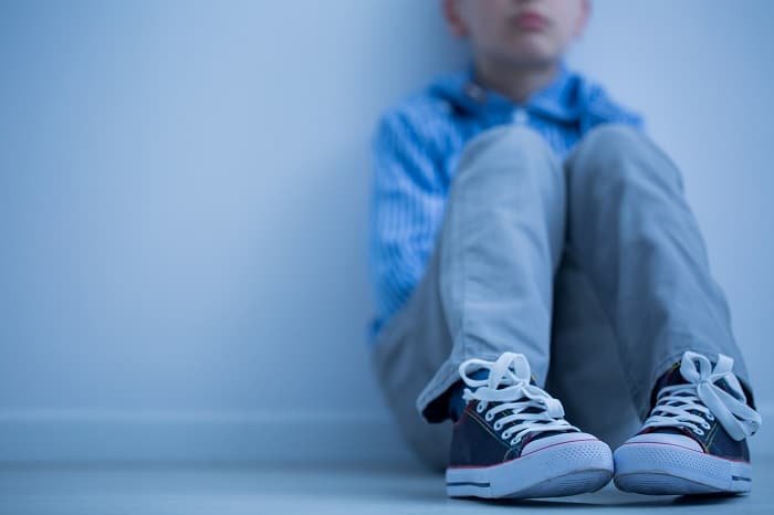 boy sitting alone